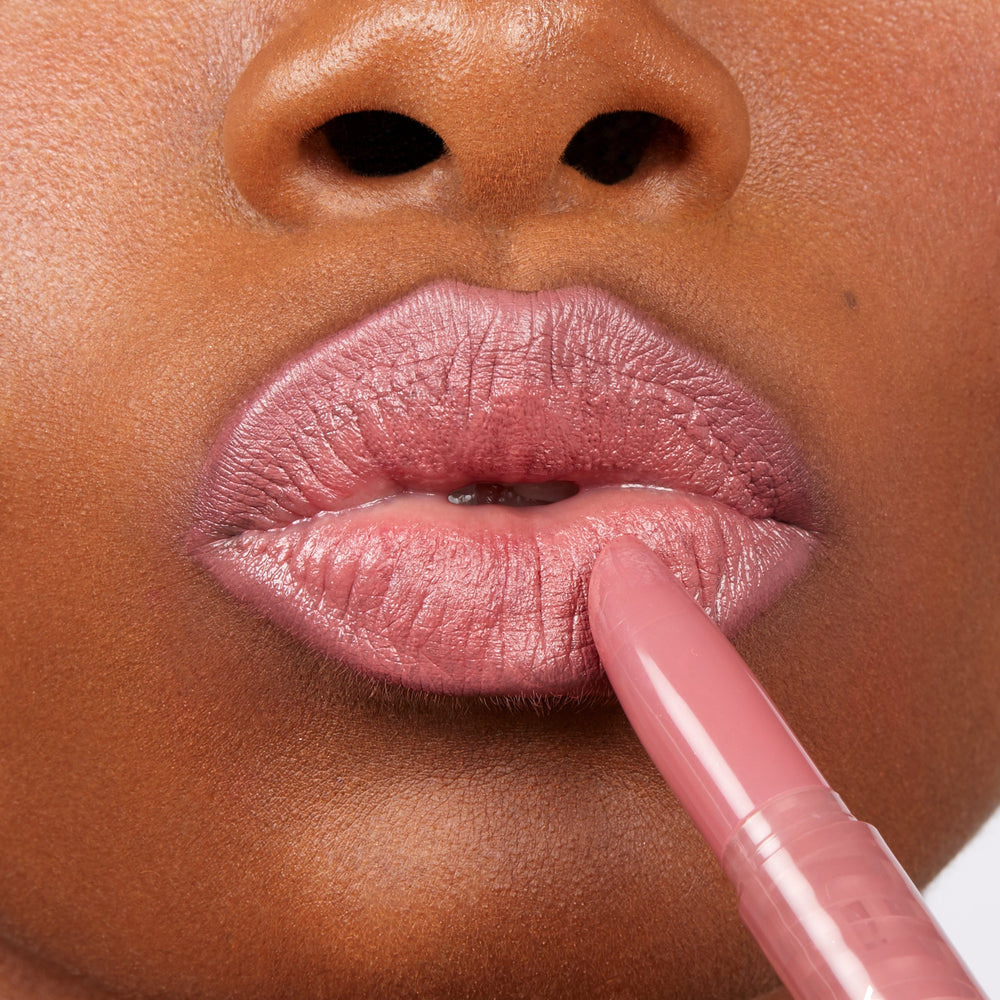 ColourPop Lippie Stix in Cami gliding onto lips, depositing a dusty rose‑mauve shade with a creamy sheen; tight close-up highlights smooth application, precise bullet tip, and true-to-color payoff.