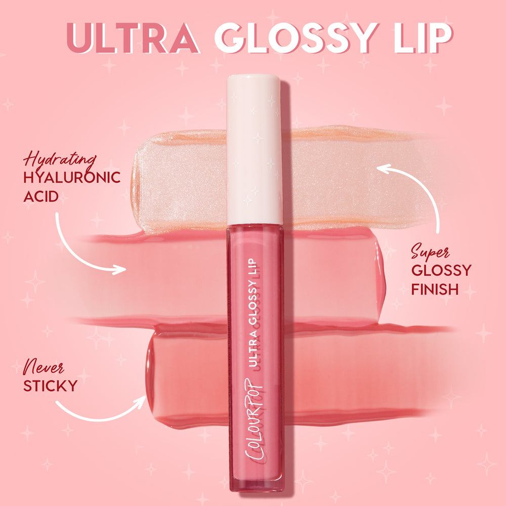 ColourPop Ultra Glossy Lip in Hit Snooze rests across pink and champagne shimmer swatches, highlighting hydrating hyaluronic acid, a never-sticky feel, and a super glossy finish; clear pink tube with white cap on a pink backdrop.