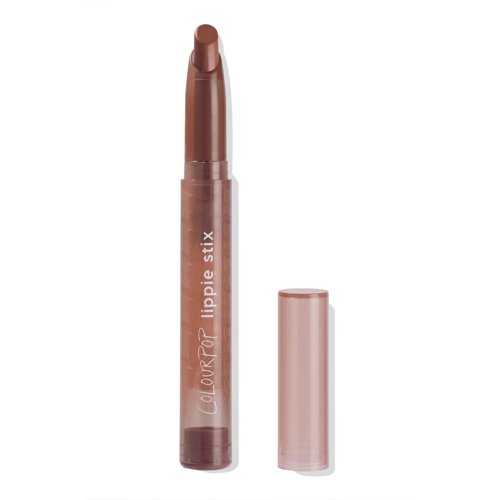 ColourPop Lippie Stix in shade Grunge standing uncapped, revealing an angled brown lipstick tip in a slim twist-up tube, the translucent rosy cap set to the side on a clean white background.