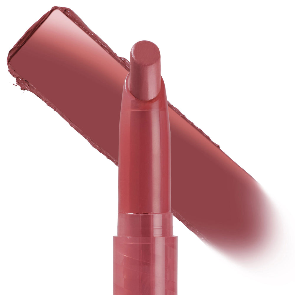ColourPop Lippie Stix in shade Happy Thoughts stands upright with the rounded bullet exposed, a rosy mauve swatch streaked diagonally behind it on a white background, highlighting the creamy lip color in a slim twist-up tube.
