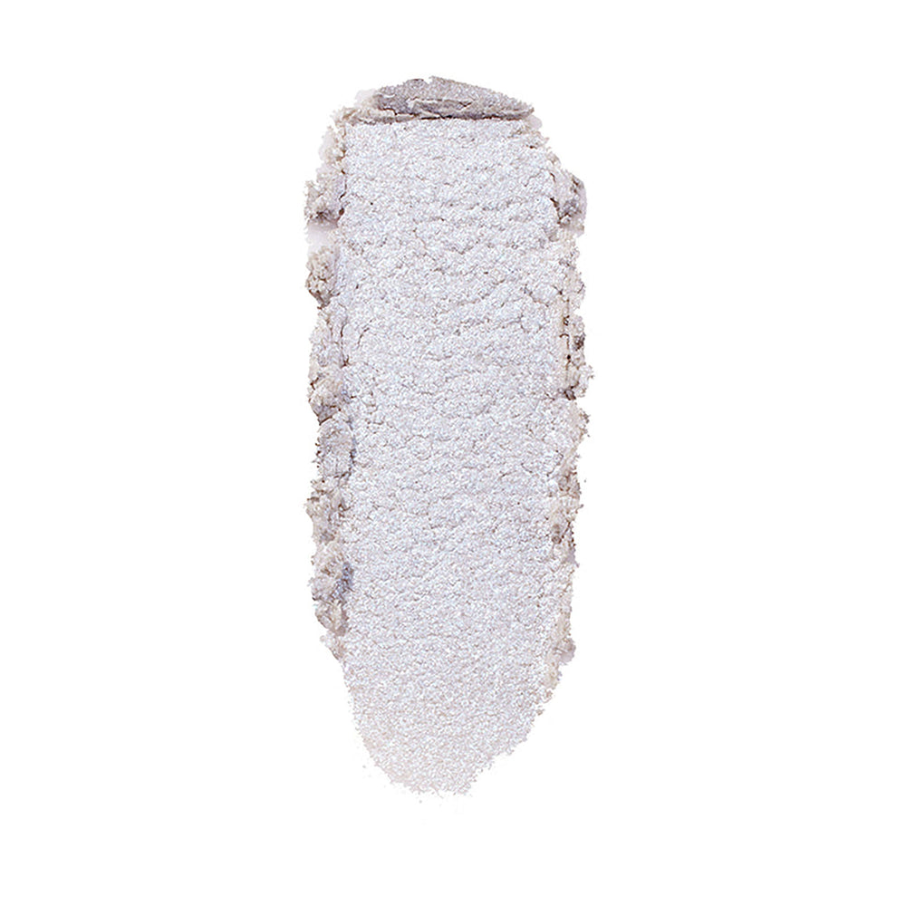 ColourPop Honeymoon Super Shock Highlighter swatch catching light as a long, oval smear of icy silver‑lavender shimmer with soft, crumbly edges, shown isolated on a clean white background.
