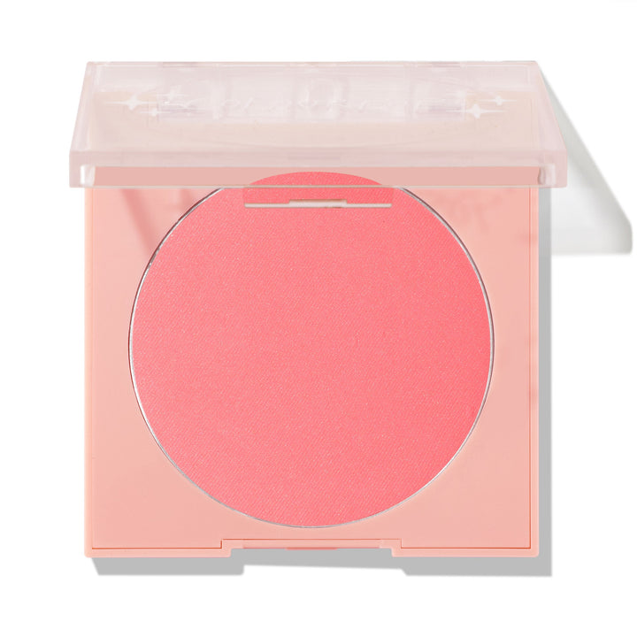 Big Reveal pressed powder blush showing a vibrant coral‑pink pan set in a pale peach square compact with a clear lid slightly open on a white background; ColourPop Pressed Powder Blush for cheeks.