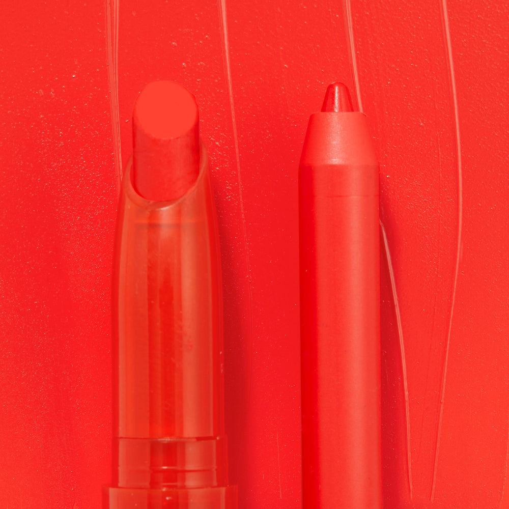 Sealed with a Kiss ColourPop Lippie Stix + Pencil Set shown side by side, creamy red Lippie Stix and matching precision lip pencil in vivid scarlet, set against a glossy red swatch background.