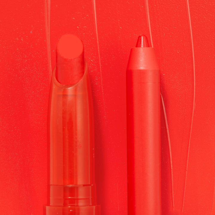 Sealed with a Kiss ColourPop Lippie Stix + Pencil Set shown side by side, creamy red Lippie Stix and matching precision lip pencil in vivid scarlet, set against a glossy red swatch background.