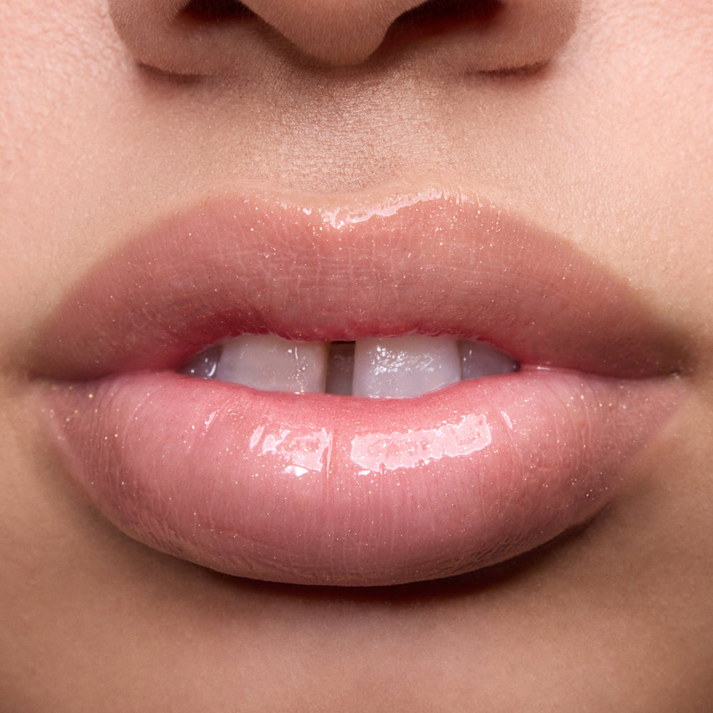 Close-up swatches of Colourpop Peach Mochi Fresh Kiss Glossy Balm on models’ lips, showing sheer peachy shimmer and high-shine finish, highlighting how this Lip Gloss & Lip Oil hybrid looks on different skin tones.