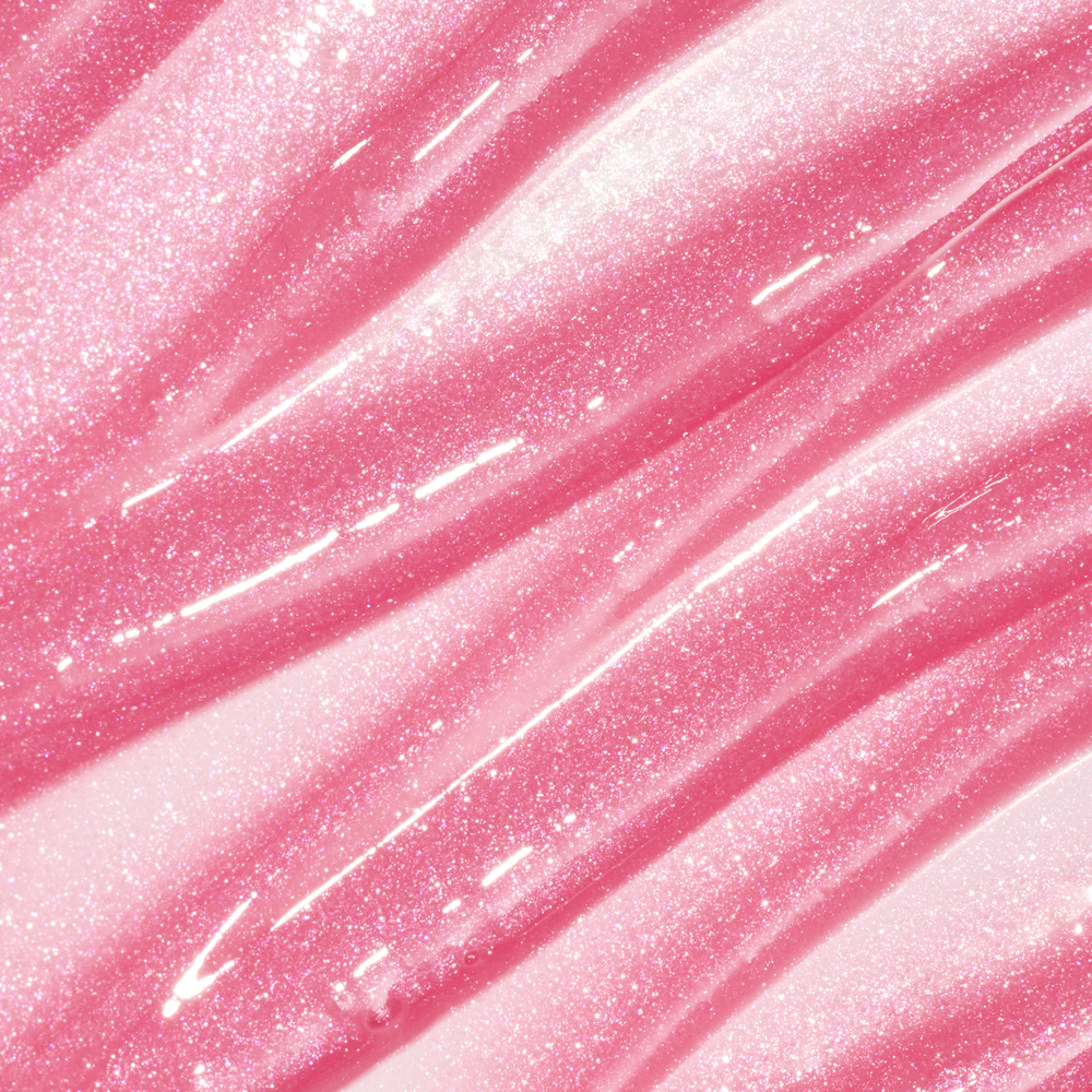 ColourPop Fresh Kiss Glossy Balm swatch in Raspberry Crème, showing sheer pink Lip Gloss & Lip Oil texture with shimmering pink and silver sparkles in smooth diagonal streaks against a glossy background.