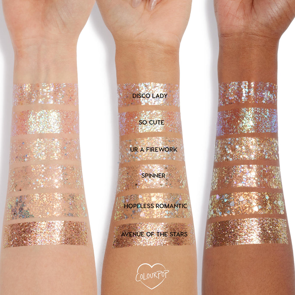 ColourPop Glitter Gel in Disco Lady swatched in wide bands across three skin tones, showing dense silver holographic sparkle; labeled rows compare Disco Lady with So Cute, UR A Firework, Spinner, Hopeless Romantic, and Avenue of the Stars.