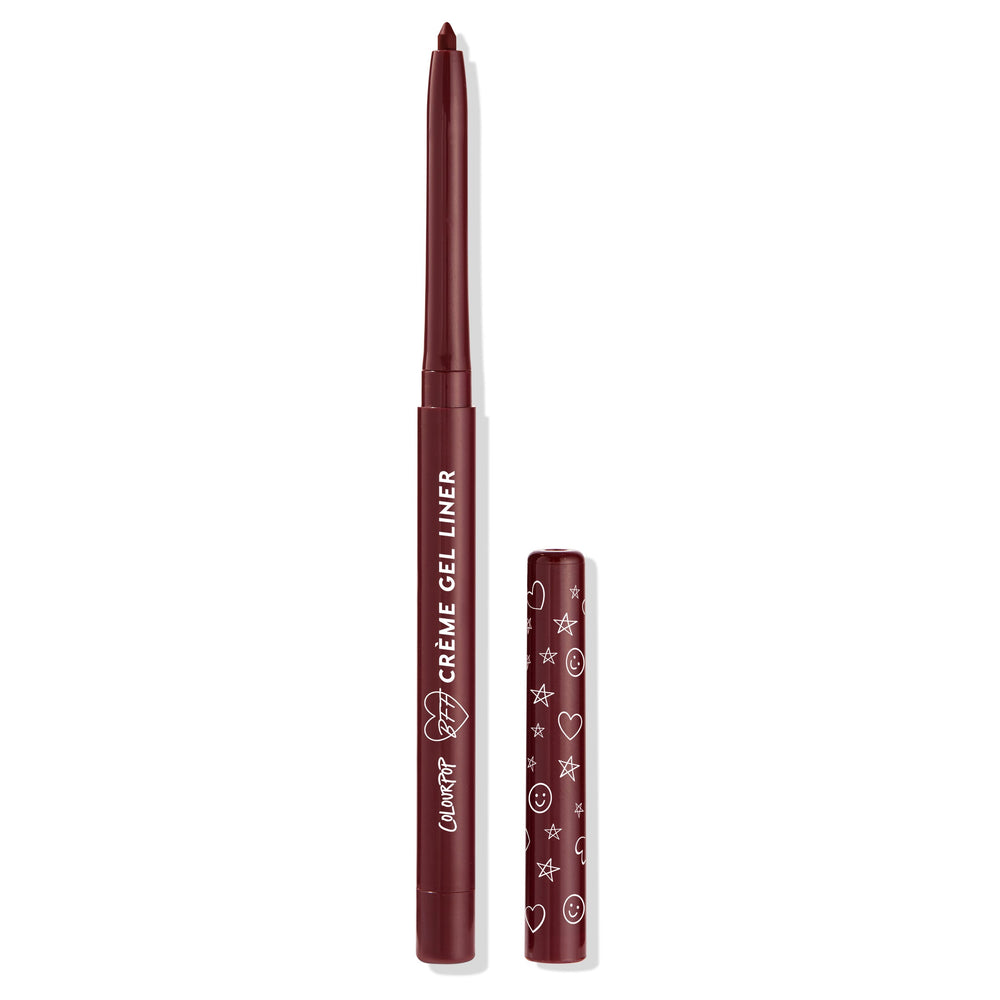 Joy Ride retractable ColourPop Crème Gel Liner with tip extended and cap off, rich burgundy shade in a matching maroon tube with white lettering and doodle icons on the cap, shown upright on a clean white background.