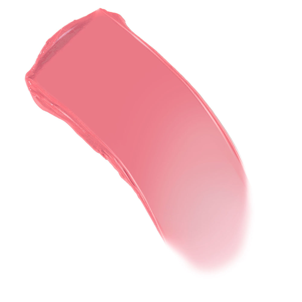 Coral pink swatch sweeping in a curved stroke on white, showcasing the creamy texture of the ColourPop Lip and Cheek Balm in Lucky U for lips and cheeks.