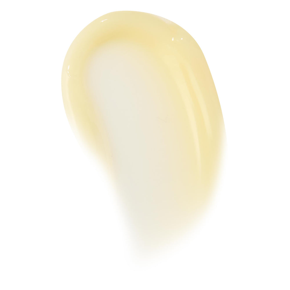 Glossy pale-vanilla swipe of Vanilla Cake lip mask, showing thick balm texture and translucent sheen on a clean white background; ColourPop Lip Mask swatch highlighting creamy, hydrating finish for overnight lip care.