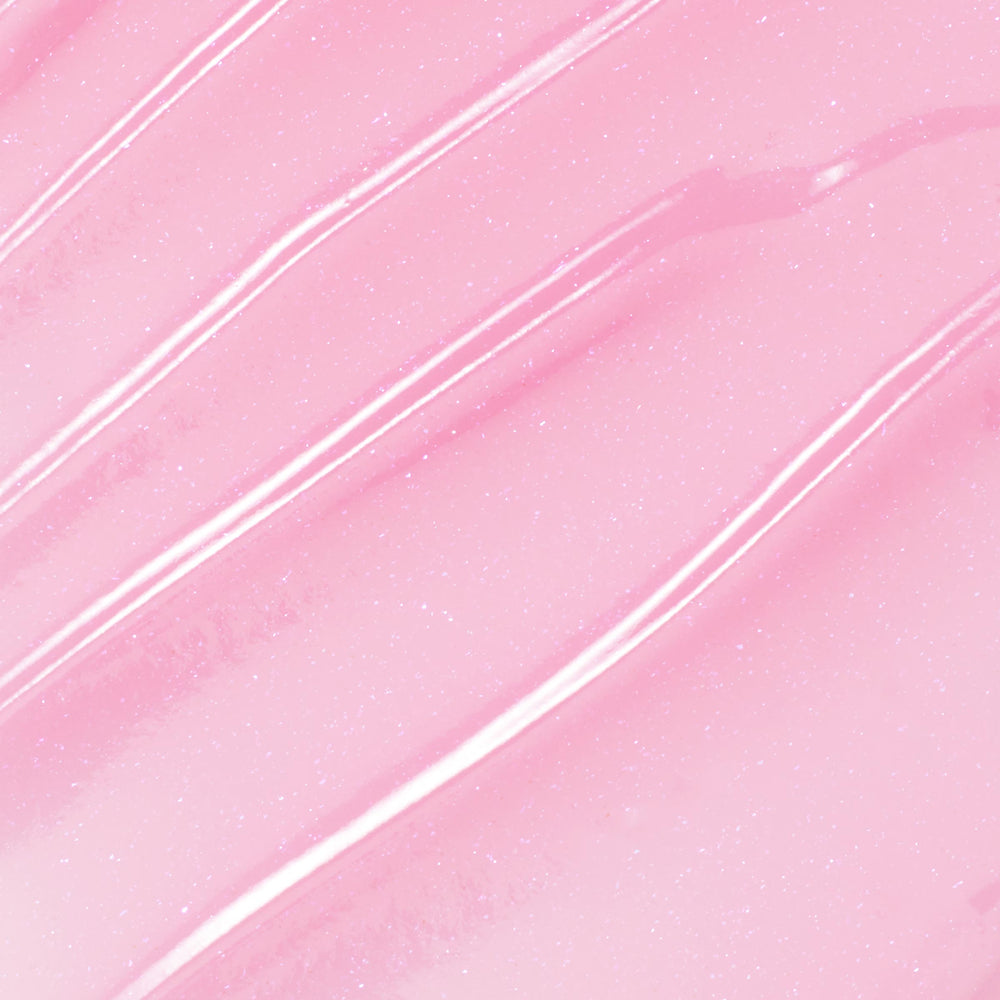 You're a Catch ColourPop Lip Mask swatch gliding in diagonal streaks, showing a sheer baby pink, glossy, micro-shimmer finish in a close-up texture shot.
