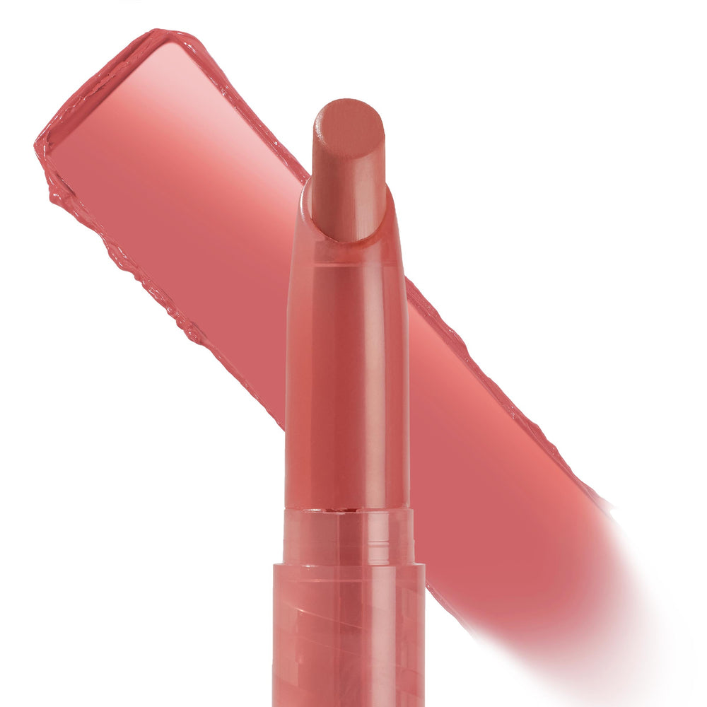 ColourPop Lippie Stix in NBD shows a creamy warm rosy nude, with the slim twist-up bullet front and a bold diagonal swatch demonstrating smooth color payoff on a clean white studio background.