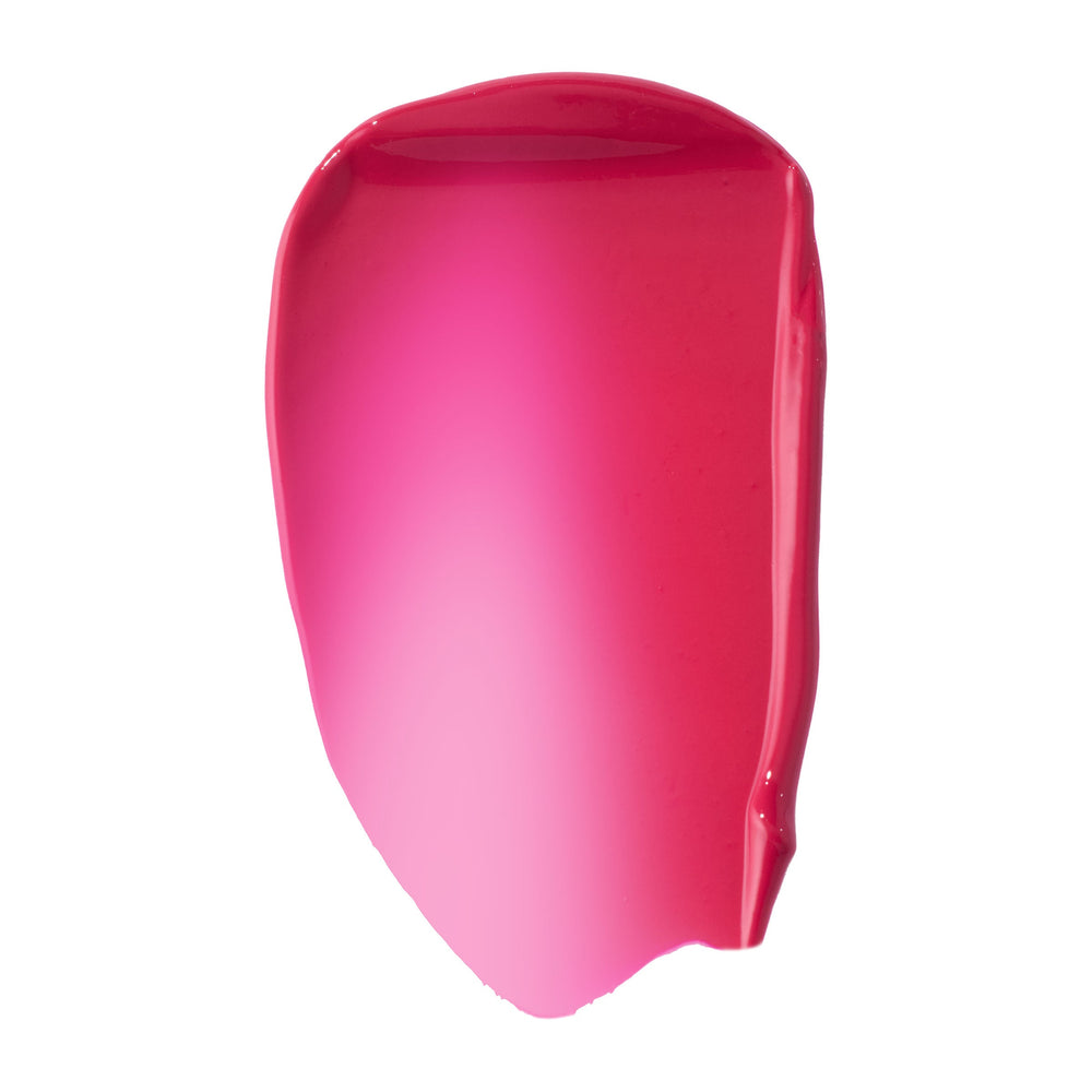 Hot pink fuchsia swatch of ColourPop Liquid Blush, shade Wildest Dreams, smeared in a glossy, high-pigment swipe that fades from sheer light pink center to deeper rosy edges on a clean white background.