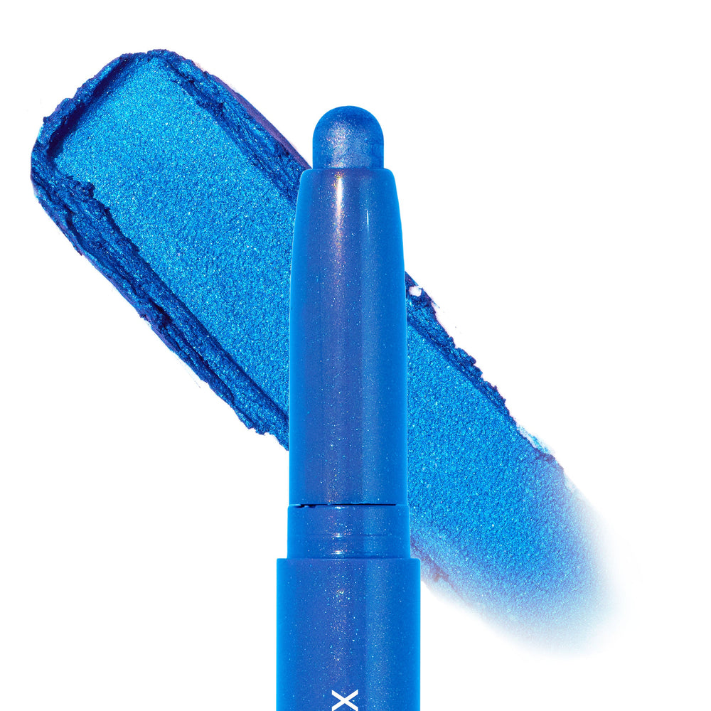 Rain Check Shadow Stix by ColourPop deposits a bold metallic cobalt-blue swatch behind the rounded tip, highlighting the creamy shimmer formula of this ColourPop Shadow Stix in a close-up studio shot on a white background.