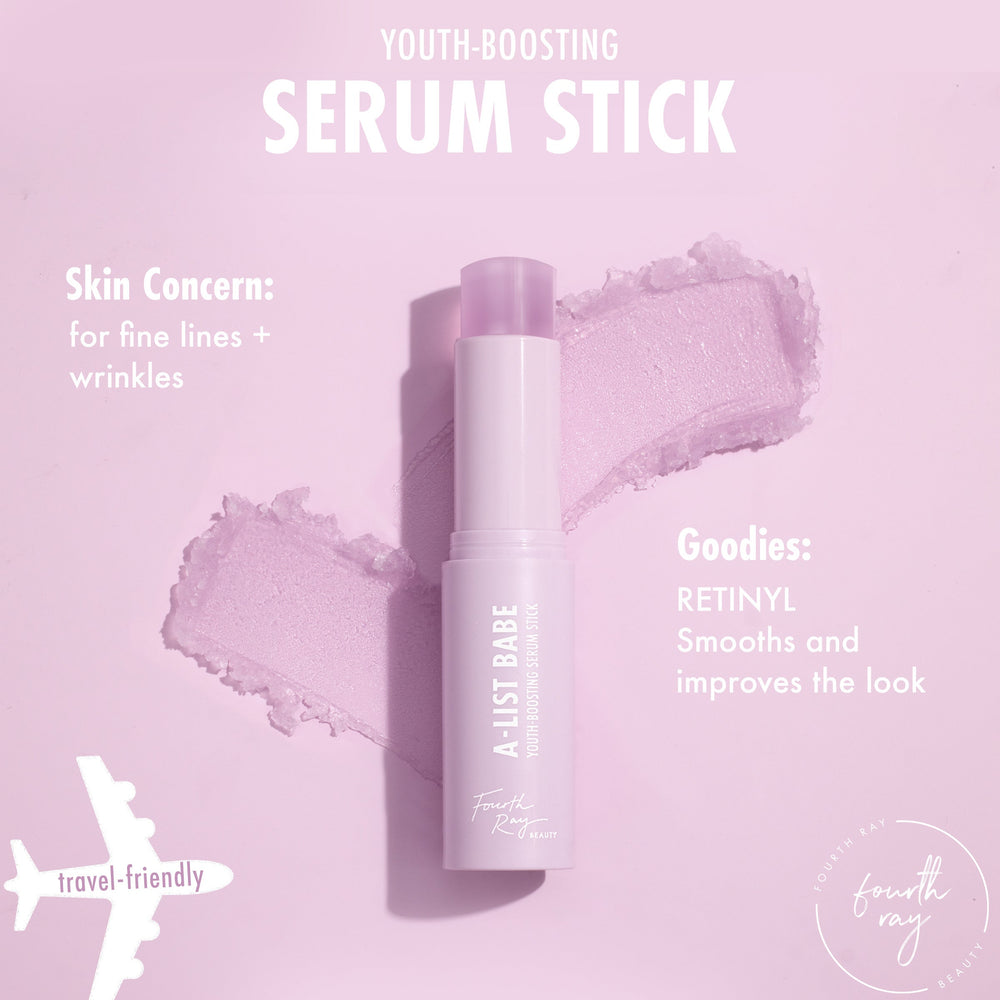 A-List Babe youth-boosting serum stick gliding open on a pastel pink smear, showing a twist-up solid serum; targeted for fine lines and wrinkles with retinyl; a travel-friendly ColourPop Serum Stick by Fourth Ray Beauty on a soft pink backdrop.