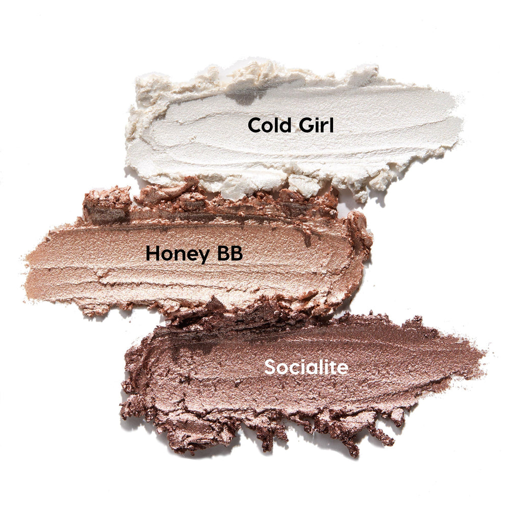 Metallic Neutrals ColourPop Shadow Stix swatches - Cold Girl (icy pearl), Honey BB (champagne gold), Socialite (rosy taupe) - smeared in thick, shimmery strokes on a white background.