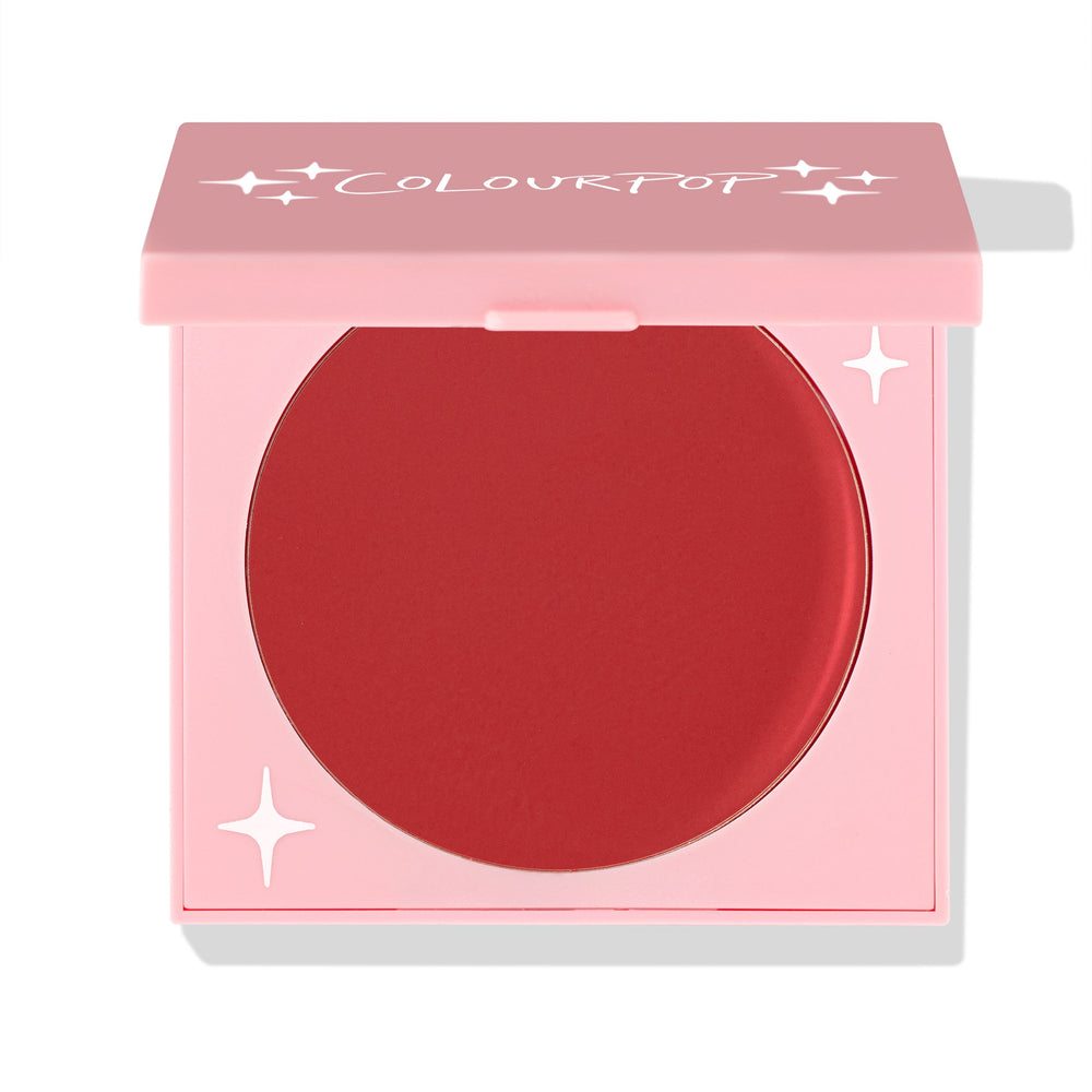 TTYL ColourPop Cream Blush in a half-closed pink compact, showcasing a large round pan of matte warm terracotta-red with star accents and the ColourPop logo on the lid, set against a white background.