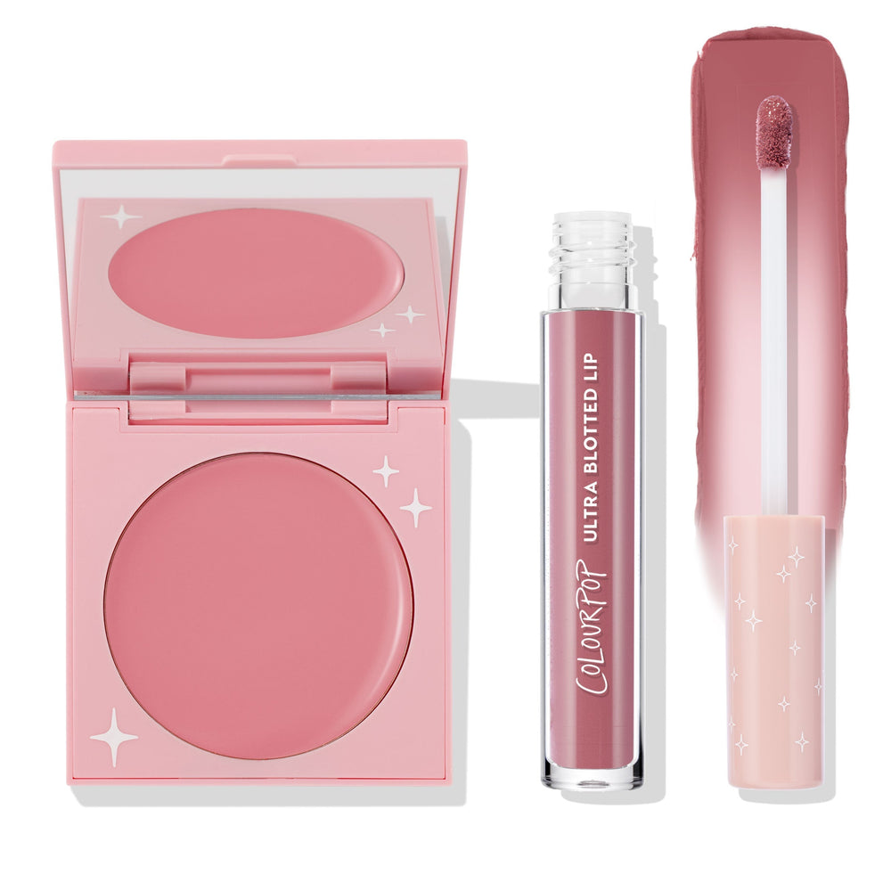 That’s So Rosy ColourPop Cheek & Lip Set featuring a rosy pink cream blush in a pink compact with star accents and a matching Ultra Blotted Lip tube with doe-foot and swatch strip, arranged on a white background for a soft monochrome look.